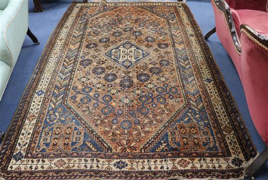 A Persian brown ground rug 247 x 161cm